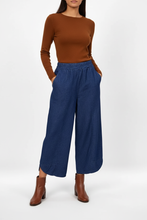 Load image into Gallery viewer, Culottes with brown long-sleeved top and ankle boots
